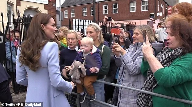 An Irish nationalist confronts Kate during a walk in north Belfast in 2022.