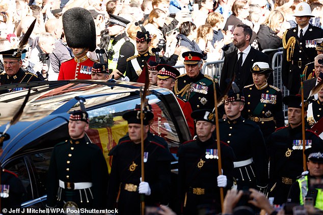 A man interrupts Prince Andrew as he walks behind the late Queen's coffin in Edinburgh in 2022