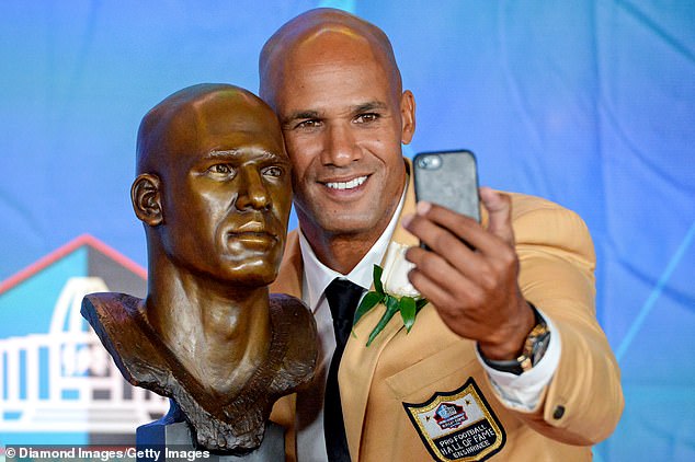 Jason Taylor poses with his bust during the Pro Football Hall of Fame enshrinement ceremony in Canton in 2017.