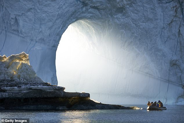 People on a raft next to icebergs (pictured). The island is known for its rich culture and stunning landscapes.