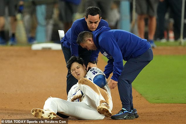 Ohtani reacts after injuring his shoulder against the New York Yankees in the seventh inning