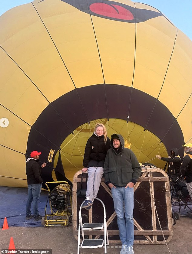 Sharing another photo from the vacation, she also posted a photo of them standing in front of a hot air balloon.