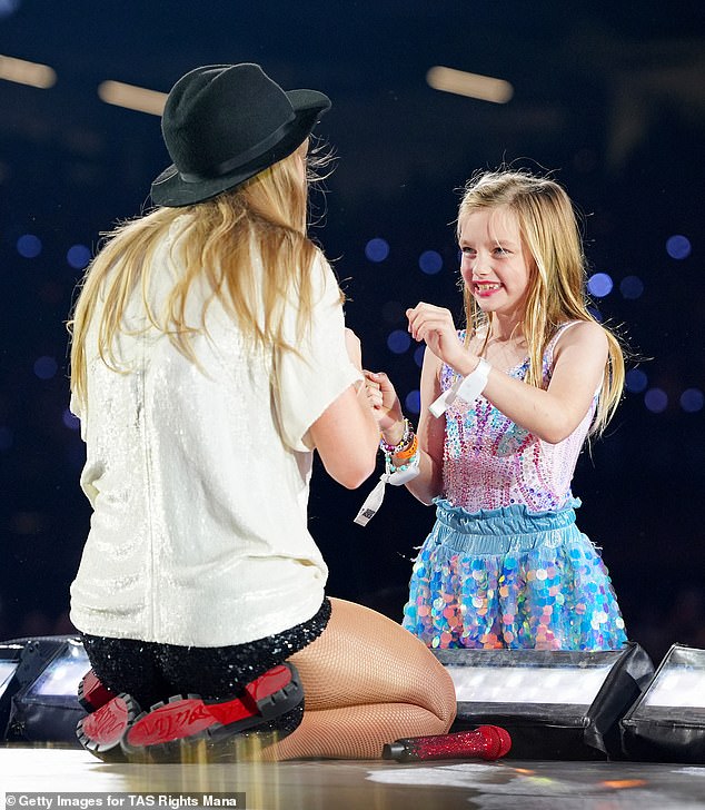 The Karma hitmaker and her fandom, dubbed Swifties, stay connected through friendship bracelets. Taylor pictured with a lucky fan on Friday night