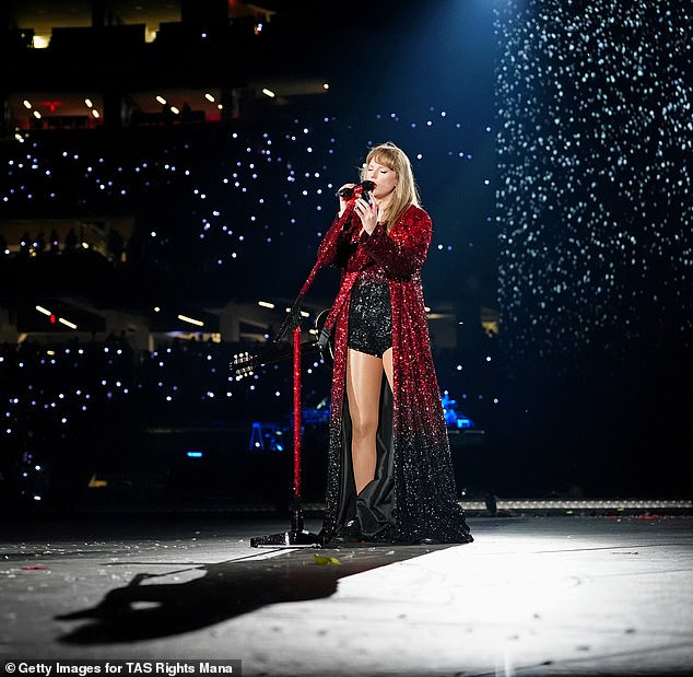 Taylor looked incredible in a bright red coat and black shorts.