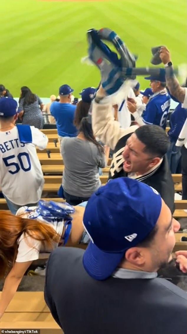 The fan twerked and pushed her partner in wild scenes at Dodger Stadium