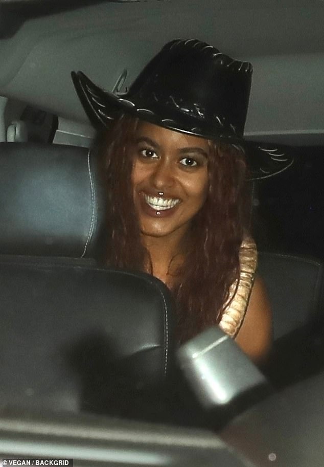 Malia smiled as she sat in the back of a car on her way to The Birds Street Club in West Hollywood.