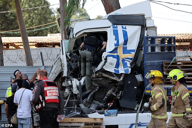 Israeli police investigate the scene of a truck that rammed outside the Glilot military base near Tel Aviv, Israel, on October 27, 2024.