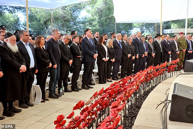 Officials attend a memorial ceremony marking the first Hebrew calendar anniversary of the Hamas attack that sparked the ongoing war in Gaza, at the Mount Herzl military cemetery in Jerusalem, October 27, 2024.