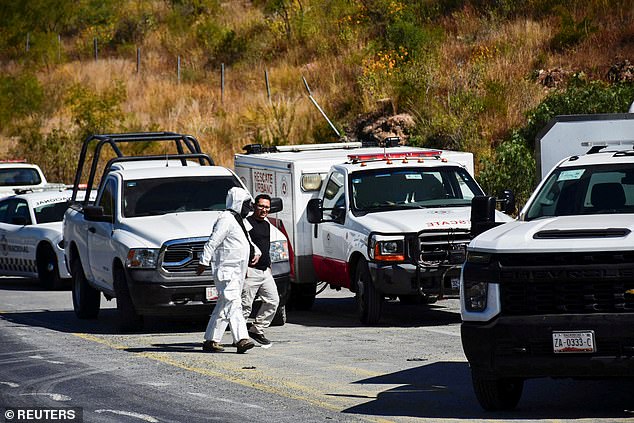 Authorities work at the scene of a passenger bus accident where several people died and others were injured while traveling on a highway from Nayarit to Chihuahua, in Piedra Gorda, Mexico, on October 26.