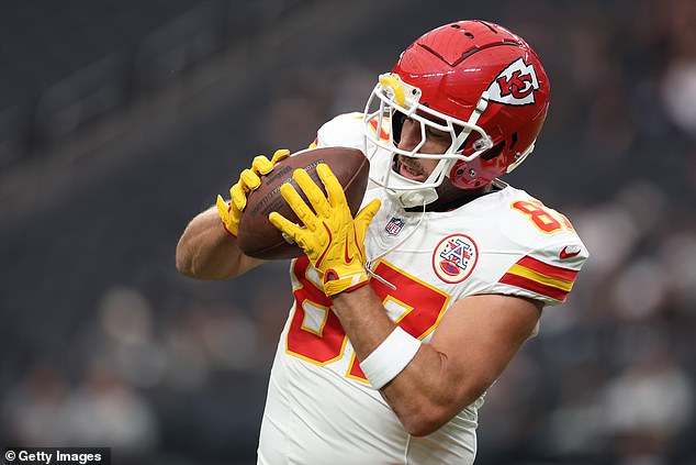 Kelce photographed on the field warming up with his team before the start of the game.