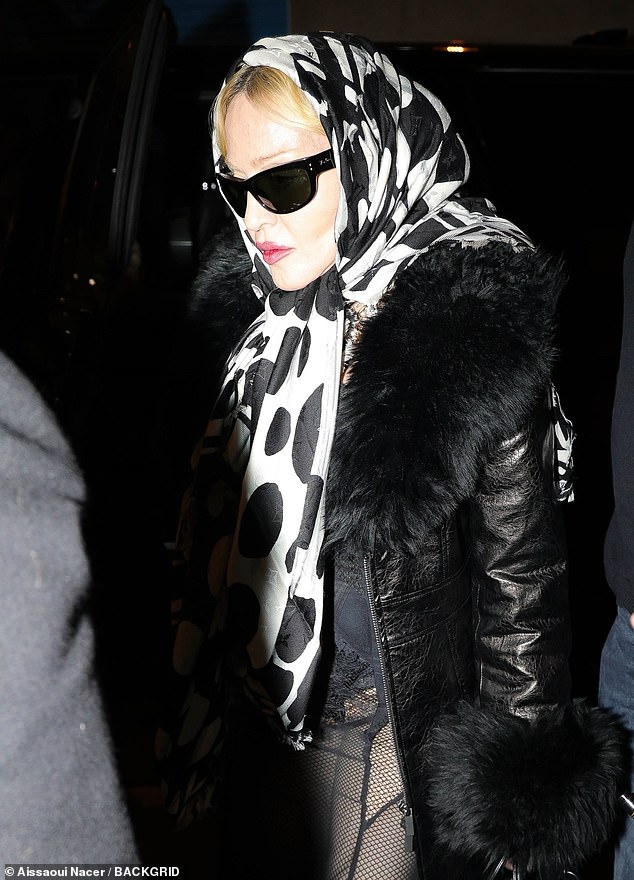 She kept a low profile with a headscarf and sunglasses.