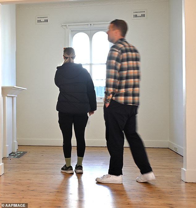 Jahan said to ensure an agent is genuine, potential buyers can ask for proof of the highest offer if the property is a private treaty (photo of buyers inspecting a property in Sydney in August)