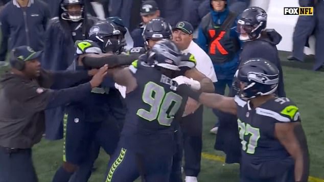 The two Seahawks teammates had to be separated as tensions rose during the loss.