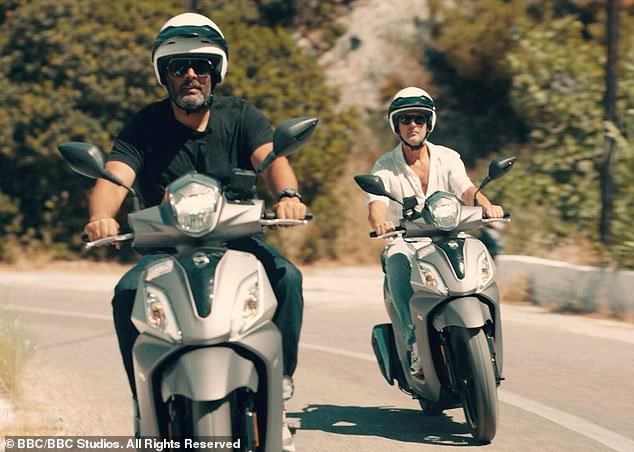 Chris Harris (left) and Paddy McGuinness (right) riding mopeds on Ikaria, a Greek island in the Aegean Sea, for the show Paddy and Chris: Road Tripping.