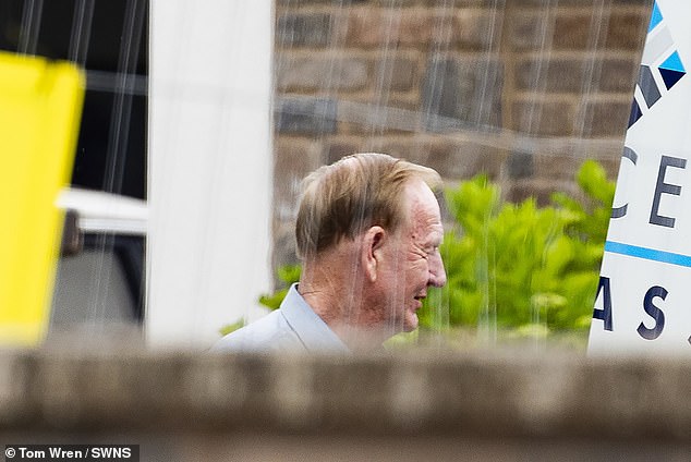 Wildin photographed outside his home in July as demolition work continued on his man cave.