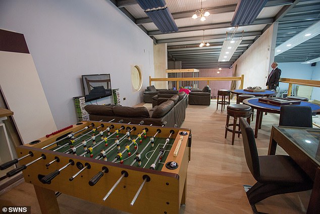 Mr. Wildin's spectacular man cave had room for a foosball table along with a comfortable living room.