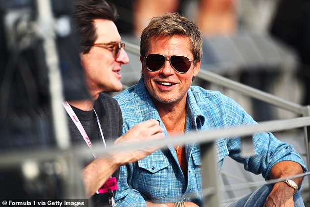 Brad Pitt jokes while on the grandstand at the F1 Mexican Grand Prix