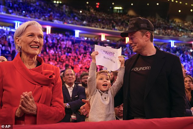 His son, whose full name is X Æ A-Xii, was also seen holding a Trump Vance sign with his father's name on it.