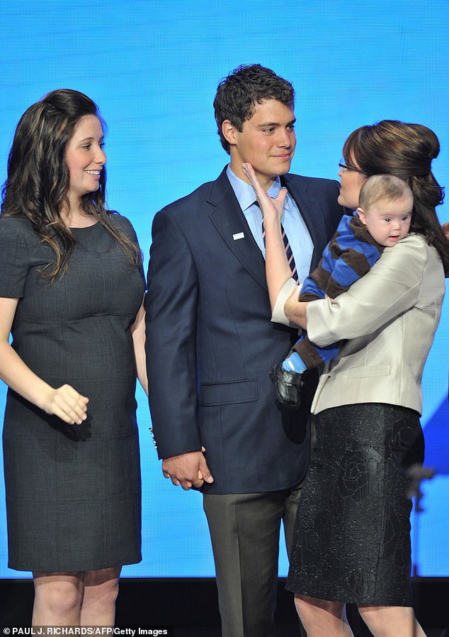 Palin was 18 when she and her ex-fiancé (M, pictured in 2008) welcomed Tripp, and the pregnancy caused a scandal in her 60-year-old mother's (R) vice-presidential campaign.