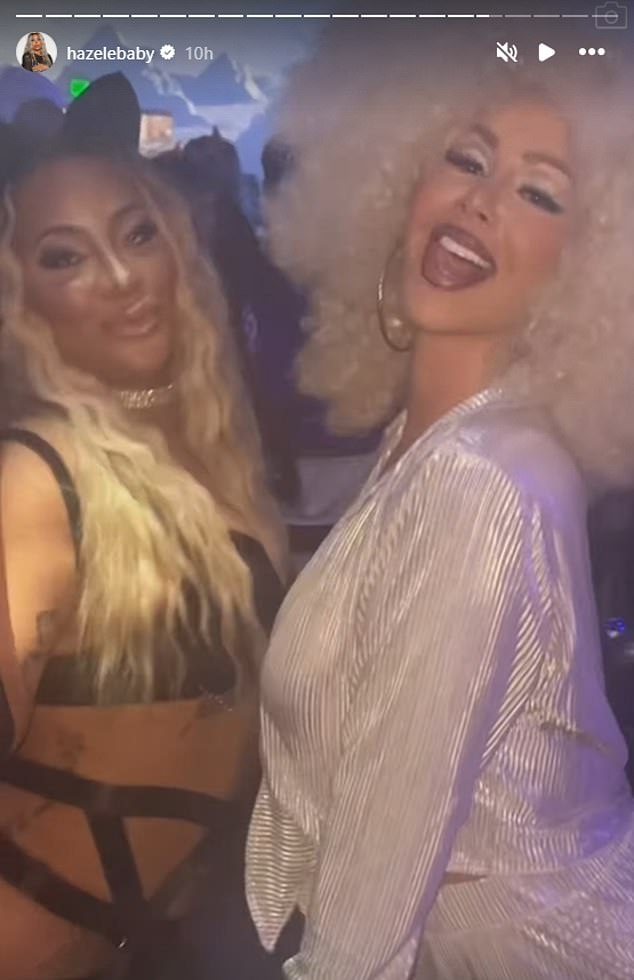 Another clip shows her posing with Girl Code Inc CEO Arica Adams, dressed in a very sexy cat suit outside the tent where the dance floor is located. 