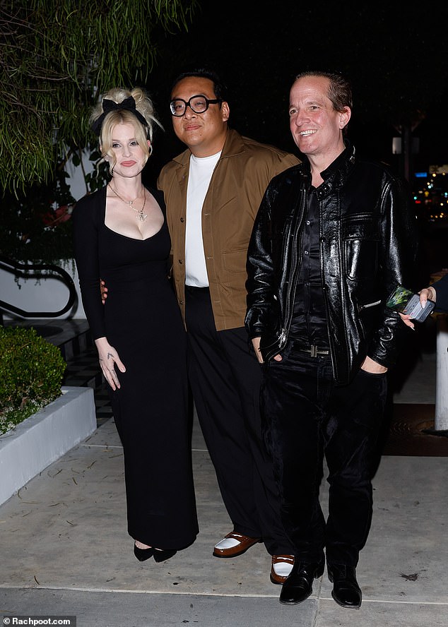 The mother of one was joined by her friends Daniel Nguyen (L) and Jeff Beacher (R) at the Birdstreet Club in West Hollywood.