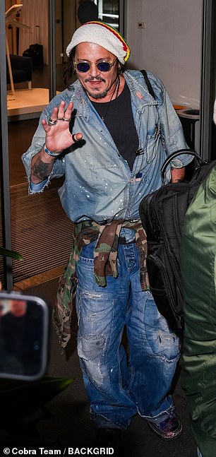 Arriving in Milan, Depp appeared to be in high spirits as he posed for photos and signed autographs.