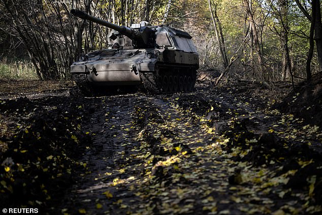 A Ukrainian service member from the 43rd Separate Artillery Brigade Hetman Taras Triasylo drives a Panzerhaubitze 2000 self-propelled howitzer, amid Russia's attack on Ukraine, at a position in the Donetsk region, Ukraine, October 26, 2024 .