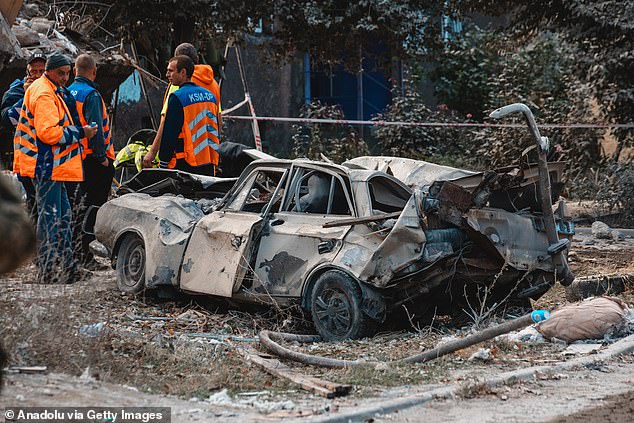 A view of damaged vehicles following a Russian rocket attack on a residential building that killed 5 people and injured 21 in Dnipro, Ukraine, on October 26, 2024.