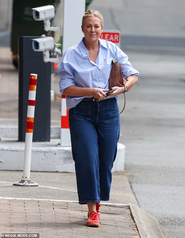 The TV veteran looked a million bucks, and every inch the network's new golden girl, wearing a sleek button-down shirt and casually tucked into a pair of dark blue jeans.