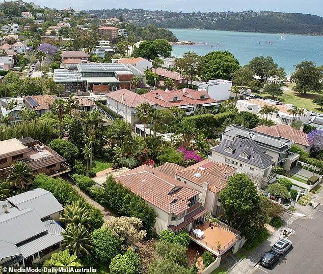 Neighbors have dismissed a local woman's claim about wild partying at a 'frat house' just off Balmoral Beach in Mosman, northern Sydney (pictured)