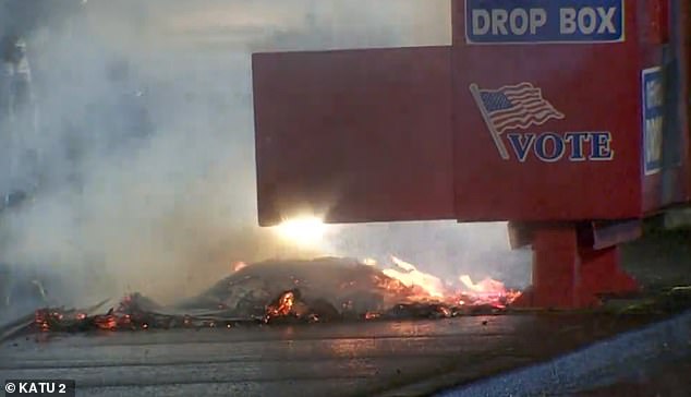 Fire was burning at the polls in Vancouver, WA, early Monday morning. Police say the fire was caused by a device placed outside the ballot box that had hundreds of ballots in it at the time.