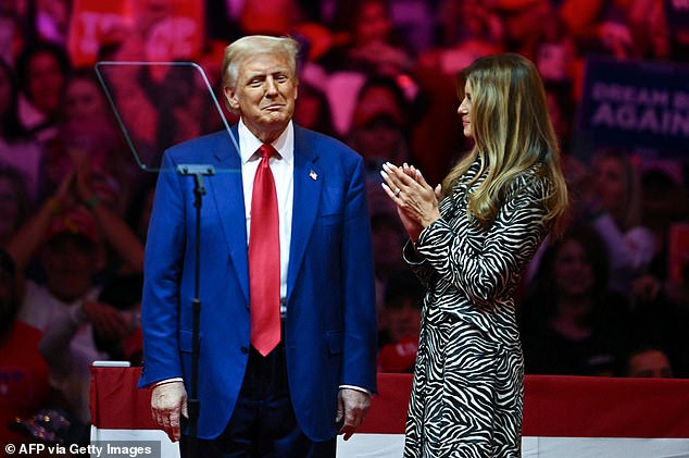 Former US first lady Melania Trump applauds her husband, former US president and Republican presidential candidate Donald Trump, after speaking at a campaign rally at Madison Square Garden.