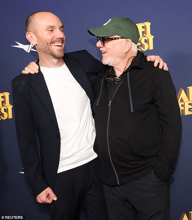 The proud father seemed to have fun as he showed his son his support for his new movie.