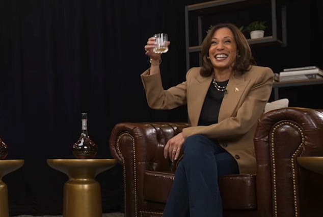 Democratic presidential candidate US Vice President Kamala Harris toasts former NFL star Shannon Sharpe.