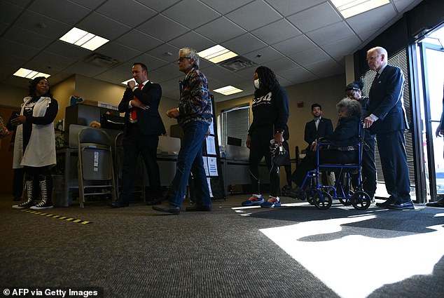 The commander in chief looked like an ordinary citizen as he stood in line with Secret Service agents and greeted a woman in a wheelchair.