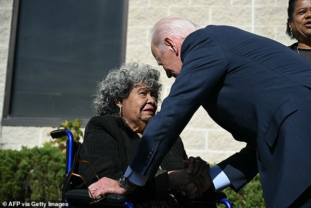 Biden greets a woman outside a polling station in New Castle, Delaware, on Monday before casting his vote in the presidential election.