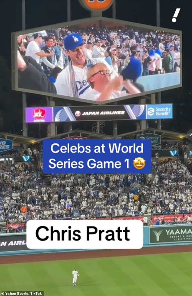 As they appeared on screen, the father-son duo, sporting matching Dodger T-shirts and baseball caps, stood up and waved enthusiastically at the camera.