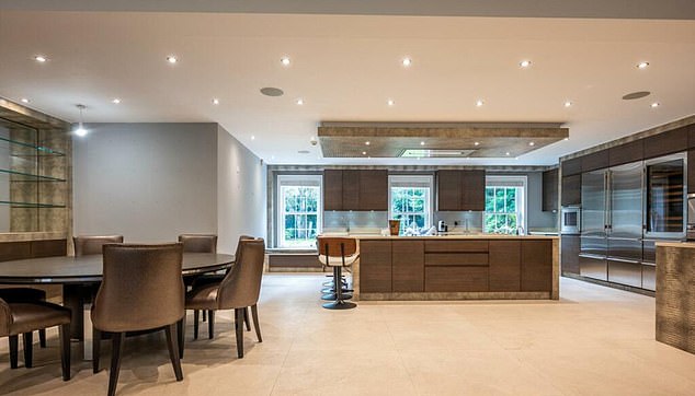 The large kitchen has its own island and also serves as a dining room for the residents of the house.