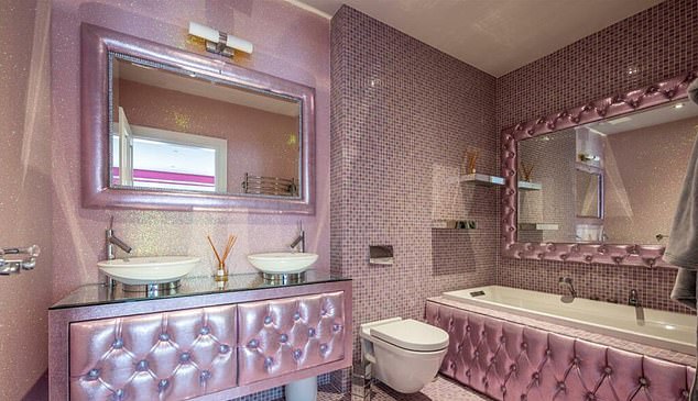 The bathroom is decorated in a less intrusive shade of pink than the bedroom.