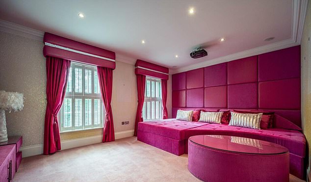 The second bedroom is completely decorated in pink and has its own private bathroom and an adjoining cinema room.