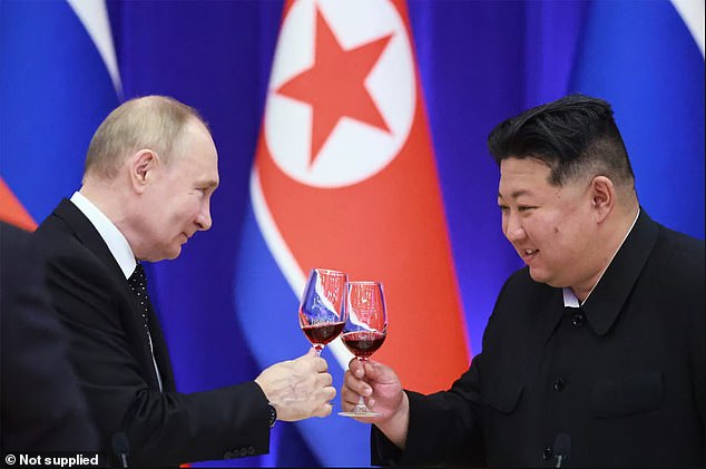 Putin and Kim clink glasses during Putin's visit to Pyongyang