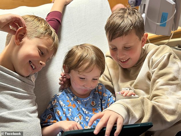 Alma Geddes, center, is pictured with her siblings while she remains in a Baltimore hospital where she was treated for Mycoplasma pneumonia.