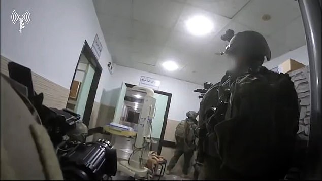 Israeli forces are seen stalking the hospital corridors with weapons drawn.