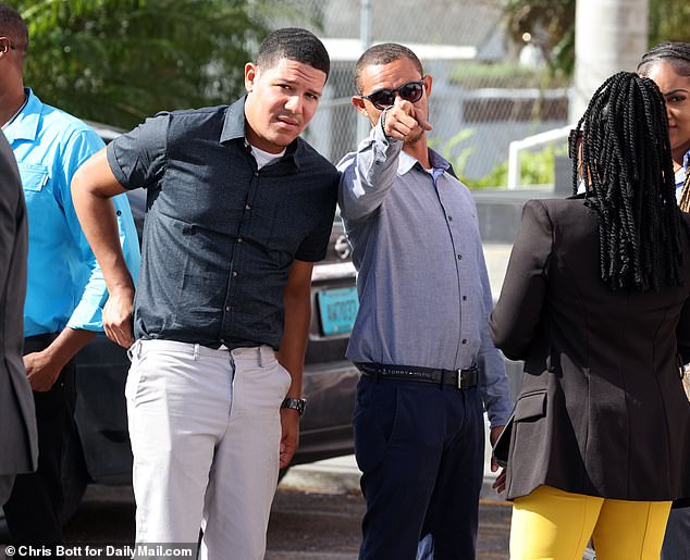 Bethel and alleged hitman Faron Newbold (right) were photographed outside the Bahamas Magistrate's Court in Nassau last November.