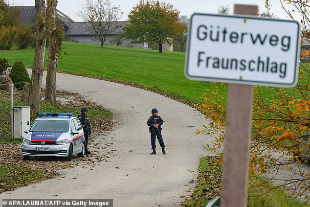 Police officers patrol in Altenfelden, Upper Austria, on October 28, 2024, after at least two men were shot dead in the Muehlviertel region in the morning.