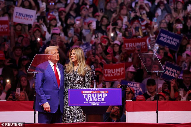 Donald Trump hugs Melania Trump during a rally at Madison Square Garden