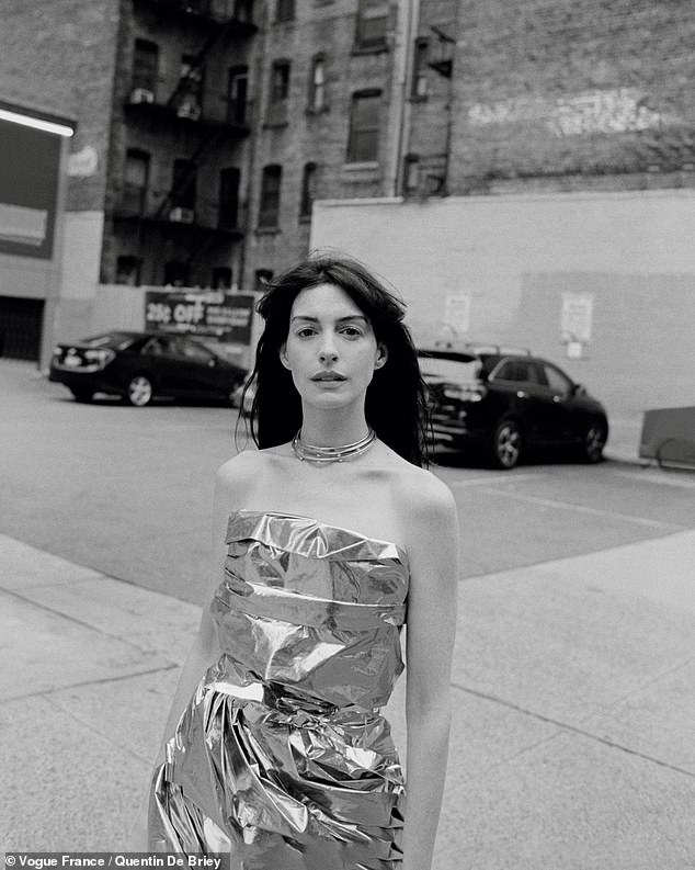 Anne then modeled a sleeveless metallic Balenciaga dress in another photo, in which she is seen posing in a parking lot.