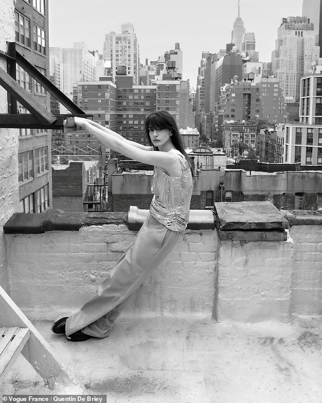 In another rooftop image, she was seen wearing a Versace top, Dickies pants and Gucci shoes.