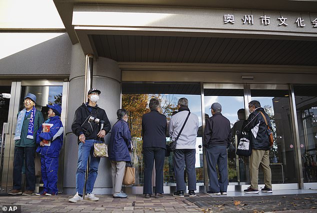 Fans in Oshu, Japan, line up to watch a broadcast of the game, with all eyes on Shohei Ohtani.