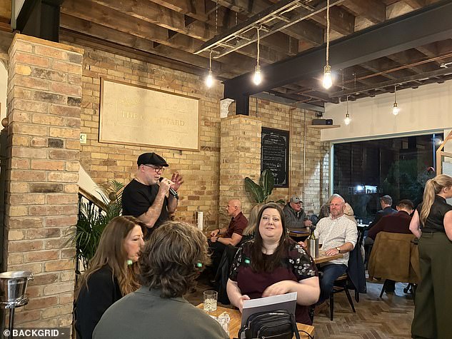 Sitting in the corner, the bearded singer sang a series of hits while they were wined and dined, possibly unaware that he won the first series of an equally famous talent show.